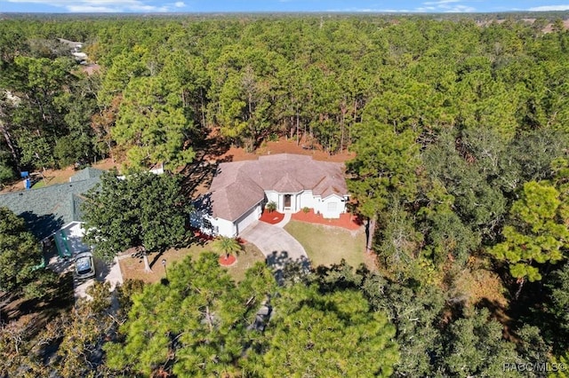 12 Colubrina Ct, Homosassa, FL 34446 - aerial view of property and surrounding area featuring a heavily wooded area