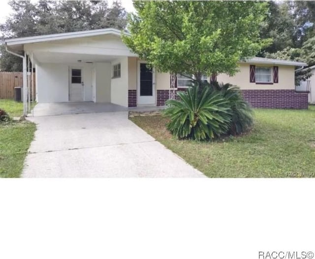 60 Roosevelt Blvd, Beverly Hills, FL 34465 - single story home featuring driveway, a front yard, fence, and stucco siding