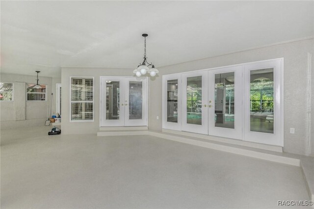 750 NW Snug Harbor Rd, Crystal River, FL 34428 - unfurnished sunroom featuring french doors