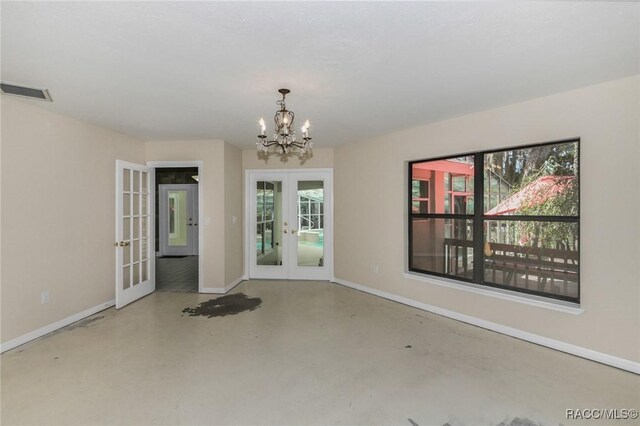 750 NW Snug Harbor Rd, Crystal River, FL 34428 - unfurnished dining area featuring french doors, concrete floors, and baseboards
