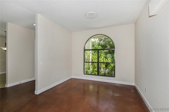 750 NW Snug Harbor Rd, Crystal River, FL 34428 - unfurnished room with concrete floors and baseboards
