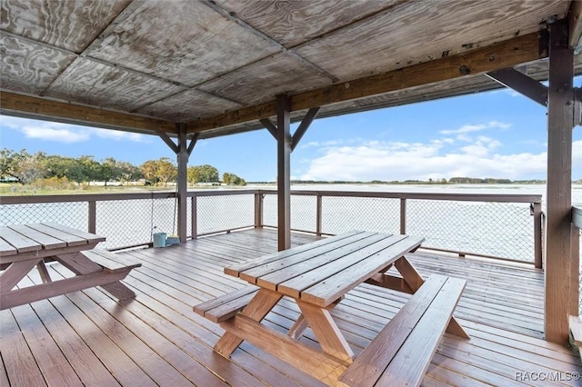 view of dock featuring a deck and outdoor dining space