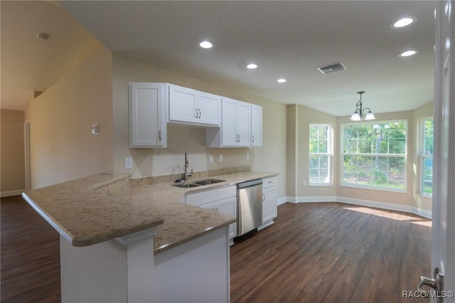 7792 N Susan Ave, Dunnellon, FL 34433 - kitchen featuring dishwasher, dark wood-style flooring, a peninsula, recessed lighting, and white cabinetry