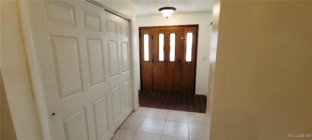 406 Wright St, Inverness, FL 34452 - doorway featuring a textured ceiling and light tile patterned floors