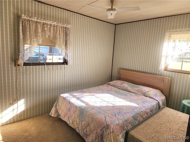 bedroom with carpet flooring, ceiling fan, and wooden ceiling