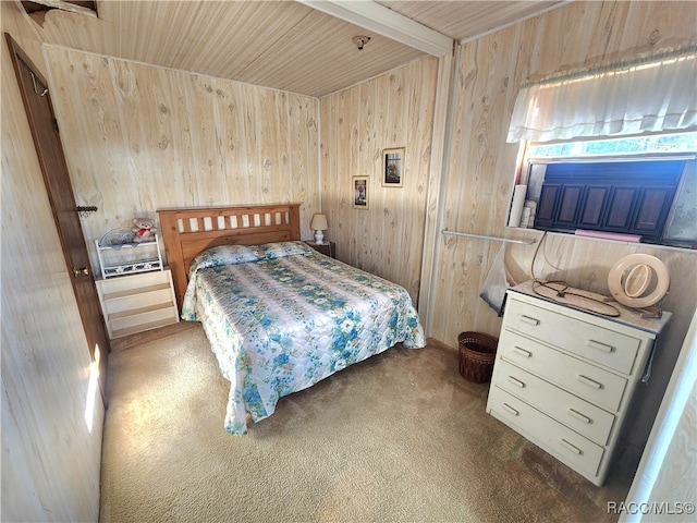 bedroom featuring carpet flooring, wooden walls, wood ceiling, and beam ceiling