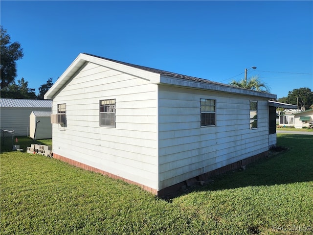 view of property exterior with a lawn