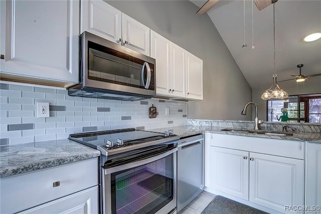 1309 Longboat Pt, Inverness, FL 34450 - kitchen featuring backsplash, white cabinets, light stone countertops, stainless steel appliances, and a sink