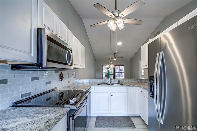 1309 Longboat Pt, Inverness, FL 34450 - kitchen featuring backsplash, a ceiling fan, lofted ceiling, stainless steel appliances, and a sink