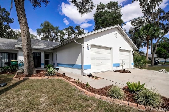 1309 Longboat Pt, Inverness, FL 34450 - exterior space featuring concrete driveway, a yard, stucco siding, and a garage