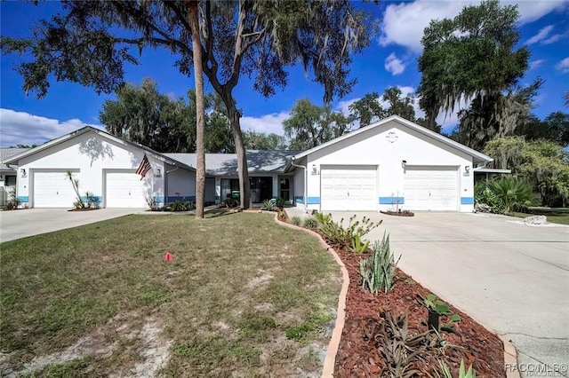 1309 Longboat Pt, Inverness, FL 34450 - ranch-style home featuring a front lawn, concrete driveway, a garage, and stucco siding