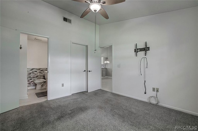 1309 Longboat Pt, Inverness, FL 34450 - unfurnished bedroom featuring visible vents, a high ceiling, carpet, connected bathroom, and french doors