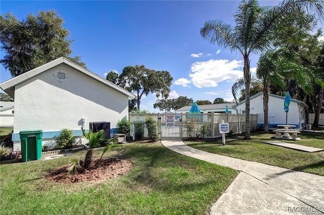 1309 Longboat Pt, Inverness, FL 34450 - view of home's community featuring fence, a gate, and a lawn