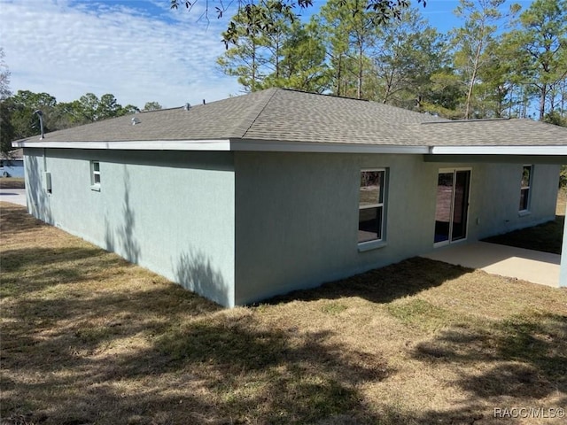 view of side of property featuring a yard