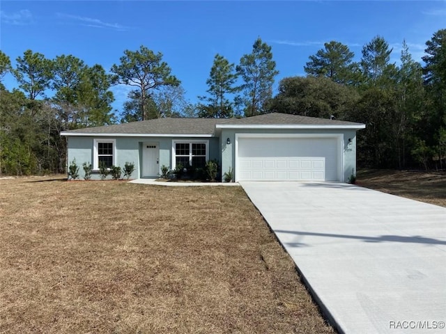 ranch-style house with a garage and a front lawn