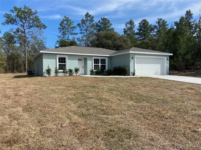 single story home featuring a garage, a front lawn, and central air condition unit