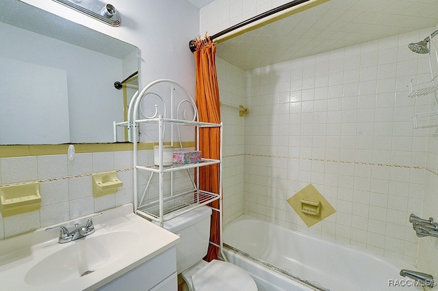 full bathroom featuring tasteful backsplash, vanity, tile walls, toilet, and tiled shower / bath