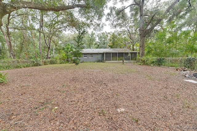 view of yard featuring a sunroom