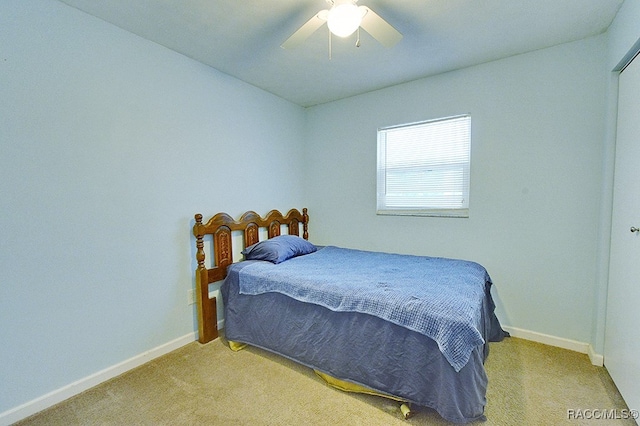 bedroom featuring ceiling fan and light colored carpet