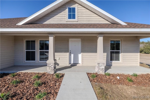 property entrance with covered porch