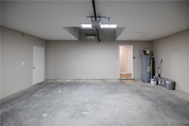 garage with a garage door opener and electric water heater