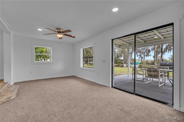 19190 SE 136th Ct, Dunnellon, FL 34431 - spare room featuring ceiling fan, carpet floors, baseboards, and recessed lighting