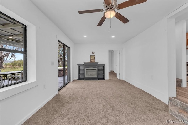 19190 SE 136th Ct, Dunnellon, FL 34431 - unfurnished living room with carpet, recessed lighting, stairway, ceiling fan, and baseboards