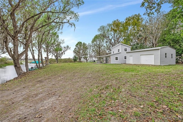 19190 SE 136th Ct, Dunnellon, FL 34431 - view of yard featuring a garage