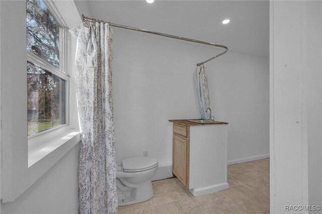 19190 SE 136th Ct, Dunnellon, FL 34431 - bathroom featuring toilet, curtained shower, tile patterned flooring, and vanity