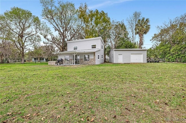 19190 SE 136th Ct, Dunnellon, FL 34431 - view of front of house with a garage, a patio area, an outdoor structure, and a front yard