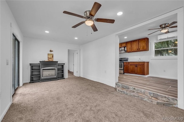 19190 SE 136th Ct, Dunnellon, FL 34431 - unfurnished living room featuring light carpet, baseboards, a ceiling fan, and recessed lighting