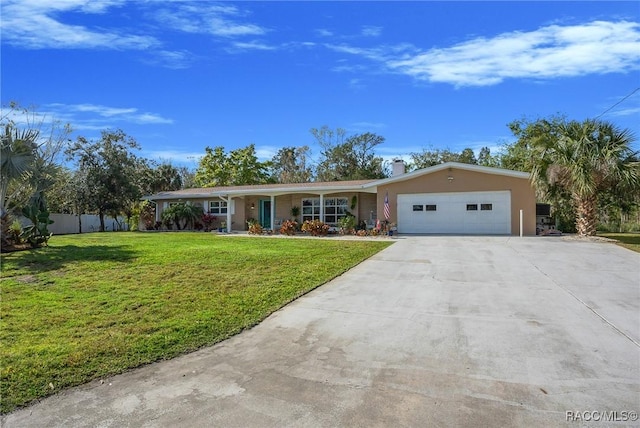 single story home with fence, an attached garage, a chimney, concrete driveway, and a front yard
