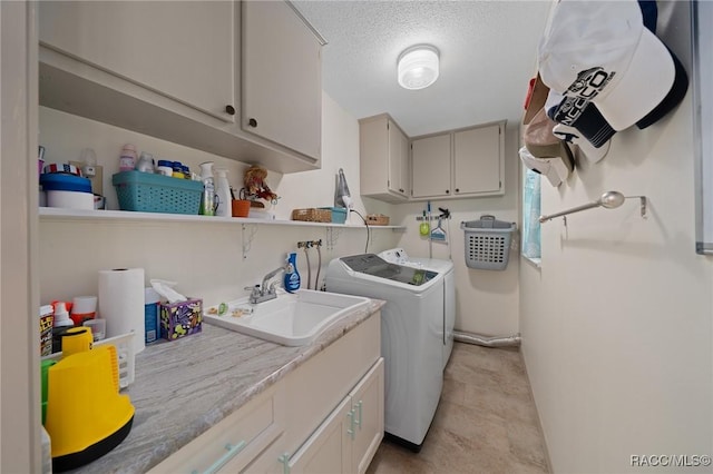 2160 N Watersedge Dr, Crystal River, FL 34429 - washroom featuring washing machine and dryer, a textured ceiling, and cabinet space