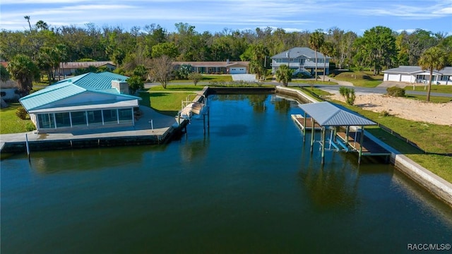 dock area with boat lift and a water view