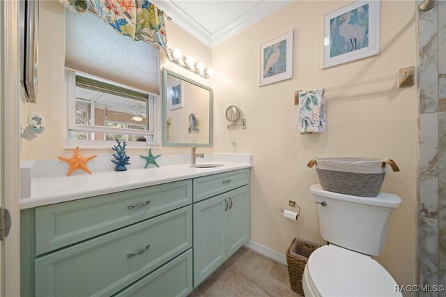 bathroom with vanity, baseboards, toilet, and crown molding