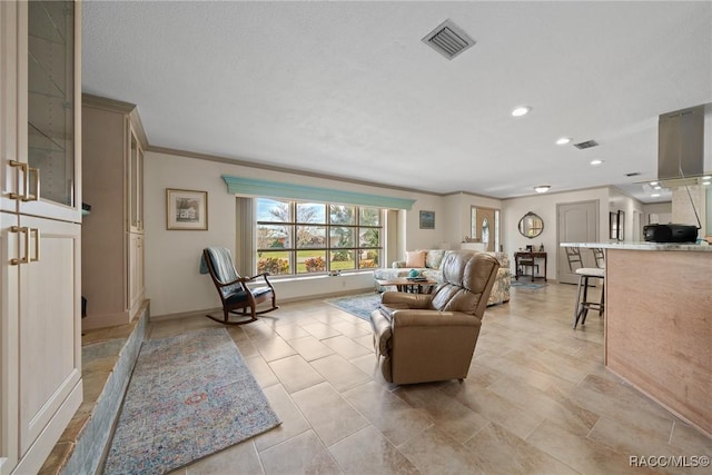 living room with baseboards, visible vents, recessed lighting, and crown molding