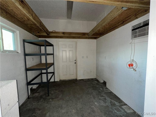 1203 SE Kings Bay Dr, Crystal River, FL 34429 - below grade area featuring concrete block wall and an AC wall unit
