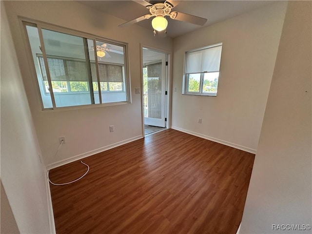 1203 SE Kings Bay Dr, Crystal River, FL 34429 - spare room with wood finished floors, a ceiling fan, and baseboards