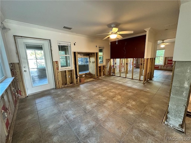 1203 SE Kings Bay Dr, Crystal River, FL 34429 - unfurnished living room featuring a ceiling fan, visible vents, and crown molding