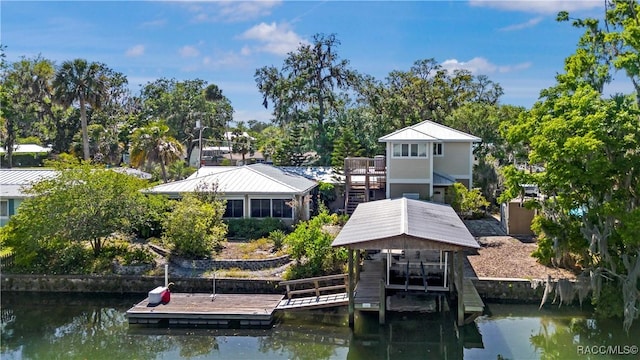 1203 SE Kings Bay Dr, Crystal River, FL 34429 - dock area featuring a water view and stairway