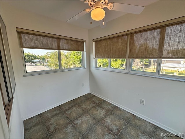 1203 SE Kings Bay Dr, Crystal River, FL 34429 - empty room with a ceiling fan and baseboards