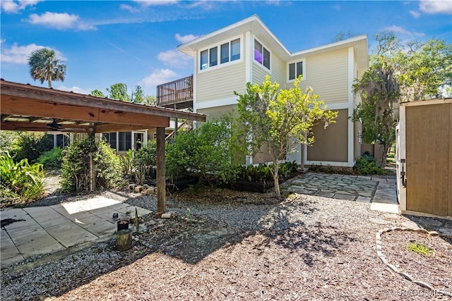 1203 SE Kings Bay Dr, Crystal River, FL 34429 - rear view of house with a patio area and a balcony