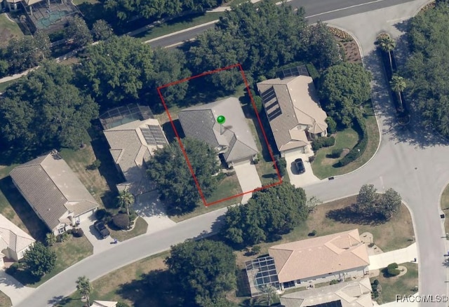 birds eye view of property with a residential view