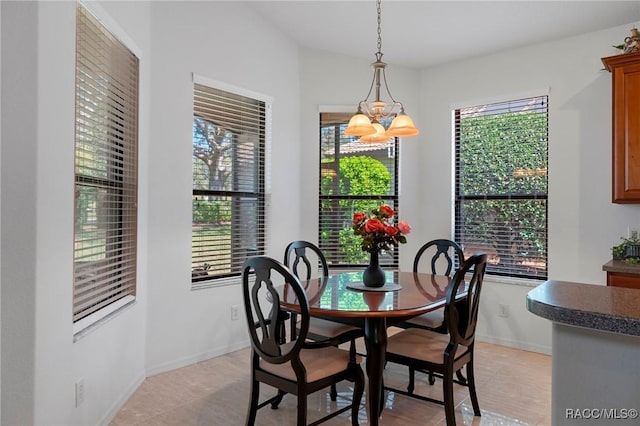 dining area featuring baseboards