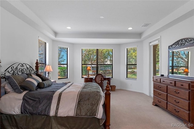 bedroom featuring light colored carpet, visible vents, baseboards, and recessed lighting