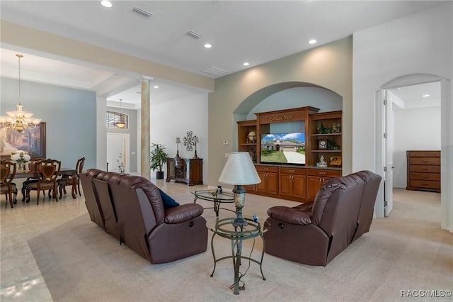 living room featuring recessed lighting, visible vents, a notable chandelier, and decorative columns