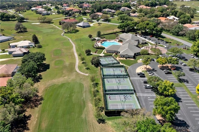 birds eye view of property featuring golf course view and a residential view