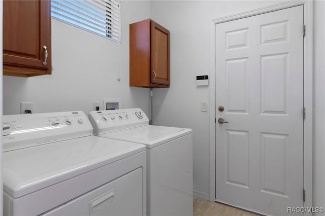 laundry area featuring cabinet space and washer and dryer