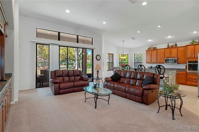 living room with recessed lighting and light carpet