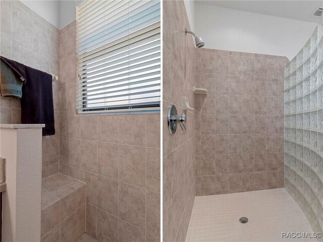 full bathroom featuring tiled shower